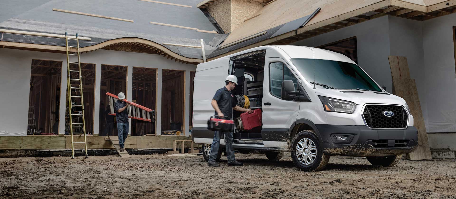 Self-employed tradesperson loading tools into a van before heading to a job