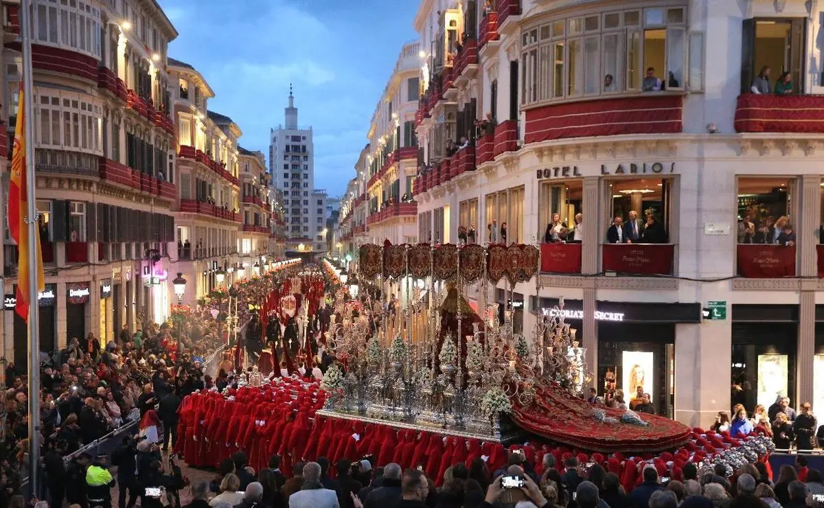 Calle Larios full of people during a Holy Week procession